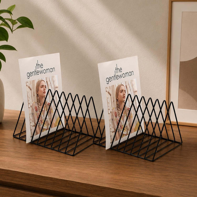 GoHooked black metal wire magazine rack, geometric design, holds magazines upright on wooden surface.