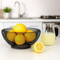 GoHooked black double-layer metal mesh fruit bowl with lemons. Stylish, durable, and airy design for kitchen countertop.