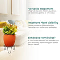 GoHooked black metal plant pot stand with an orange pot and green plant, 8-inch diameter.