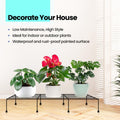GoHooked black metal rectangular plant stand holding three potted plants indoors. Features rust-proof finish.