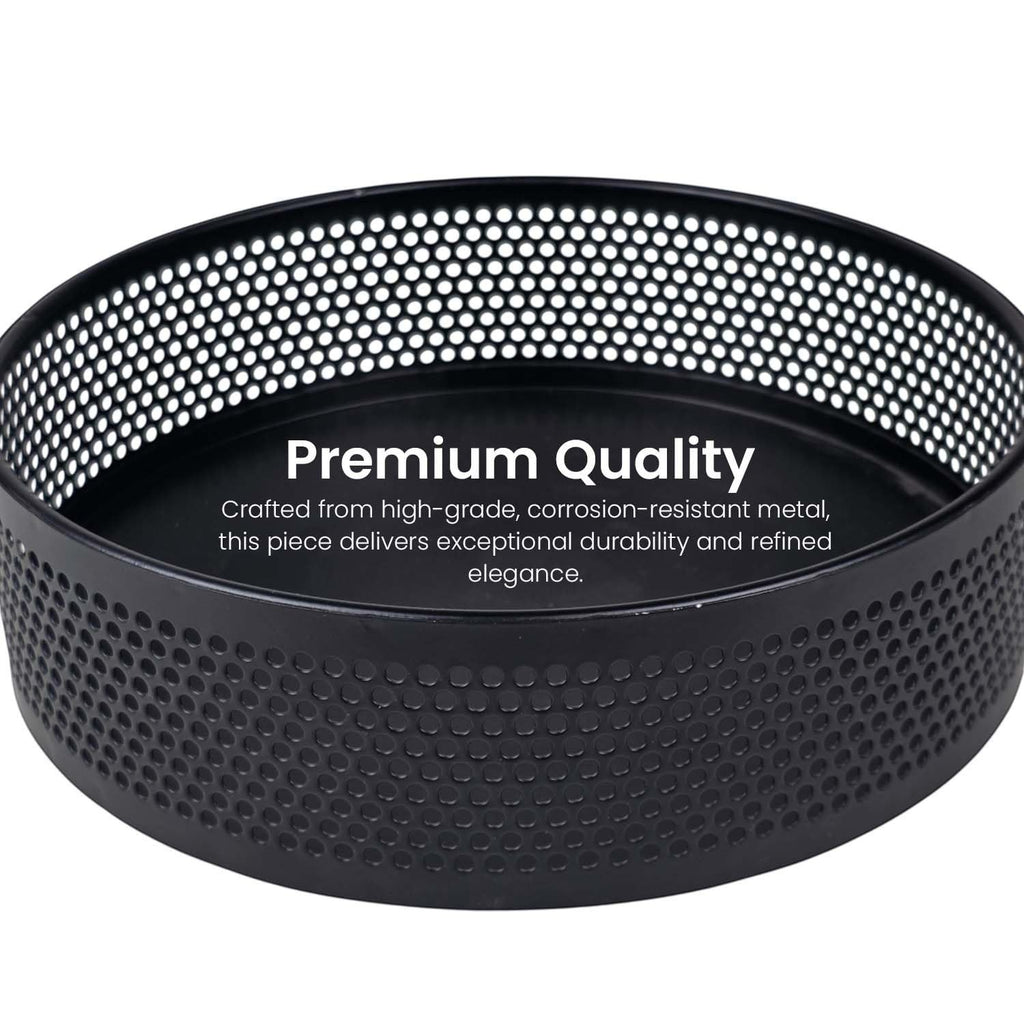 Go Hooked black metal revolving fruit basket with a perforated mesh design and raised edge. Modern lazy Susan organizer.
