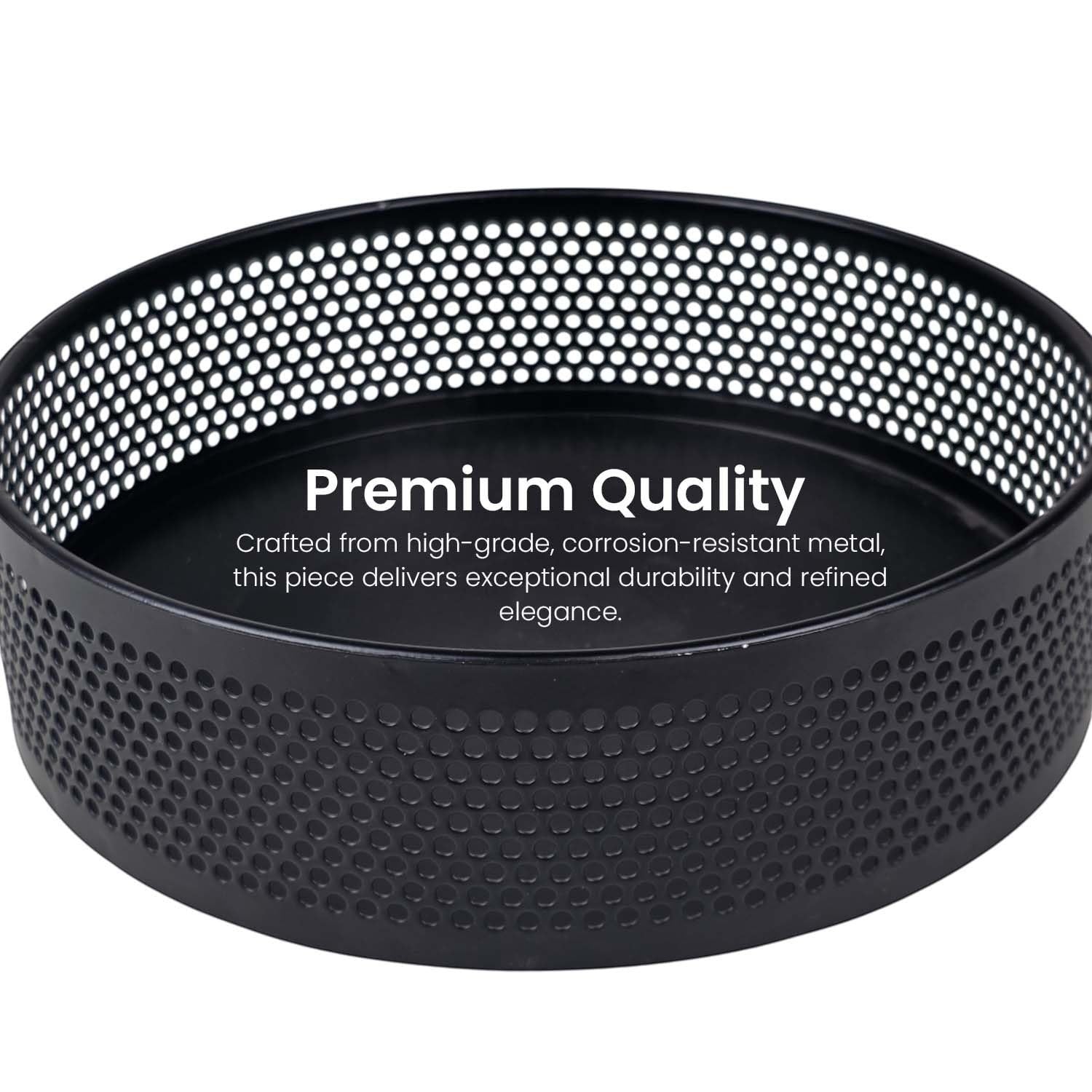 Go Hooked black metal revolving fruit basket with a perforated mesh design and raised edge. Modern lazy Susan organizer.