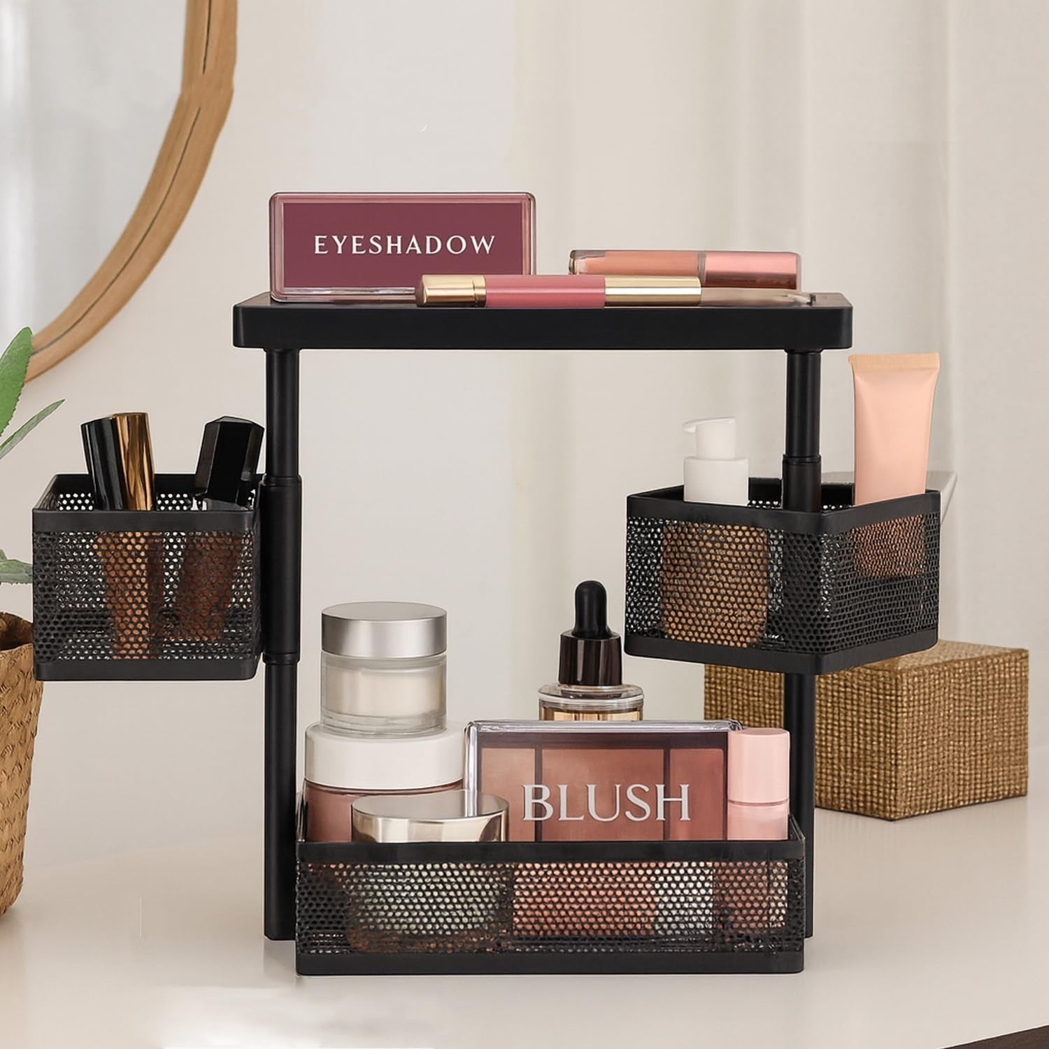 GoHooked black metal 3-tier rotating storage organizer with mesh baskets holding cosmetics and toiletries.