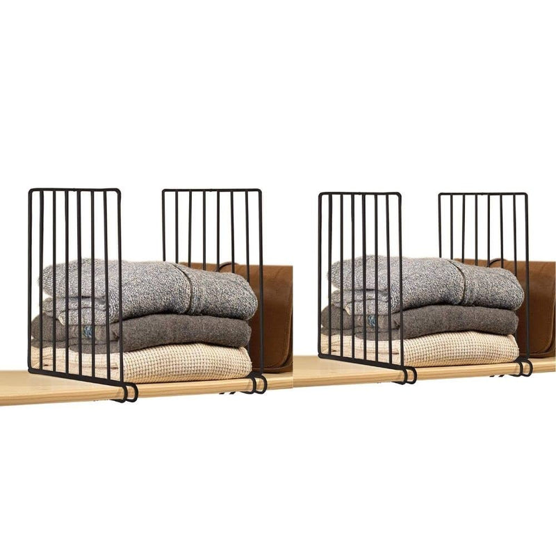 Go Hooked black metal shelf dividers organizing stacks of sweaters and fabric on a wooden shelf.