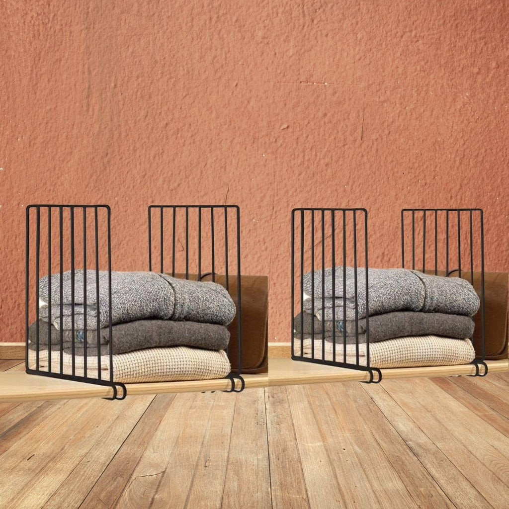 GoHooked black metal shelf dividers organize folded clothes and bags on a wooden shelf.