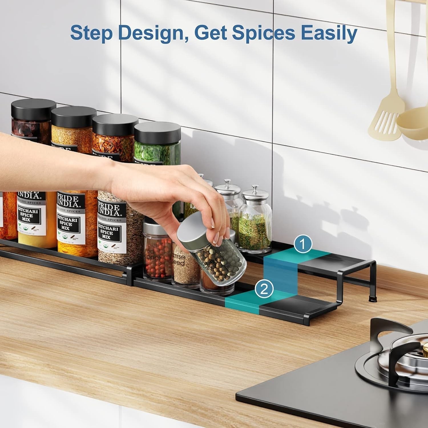 Go Hooked black metal 2-tier expandable spice rack organizer with guardrails on a wooden countertop.