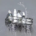 Go Hooked black metal wall-mounted storage basket with hooks, holding various bottles and jars. Water splashes around the shelf.