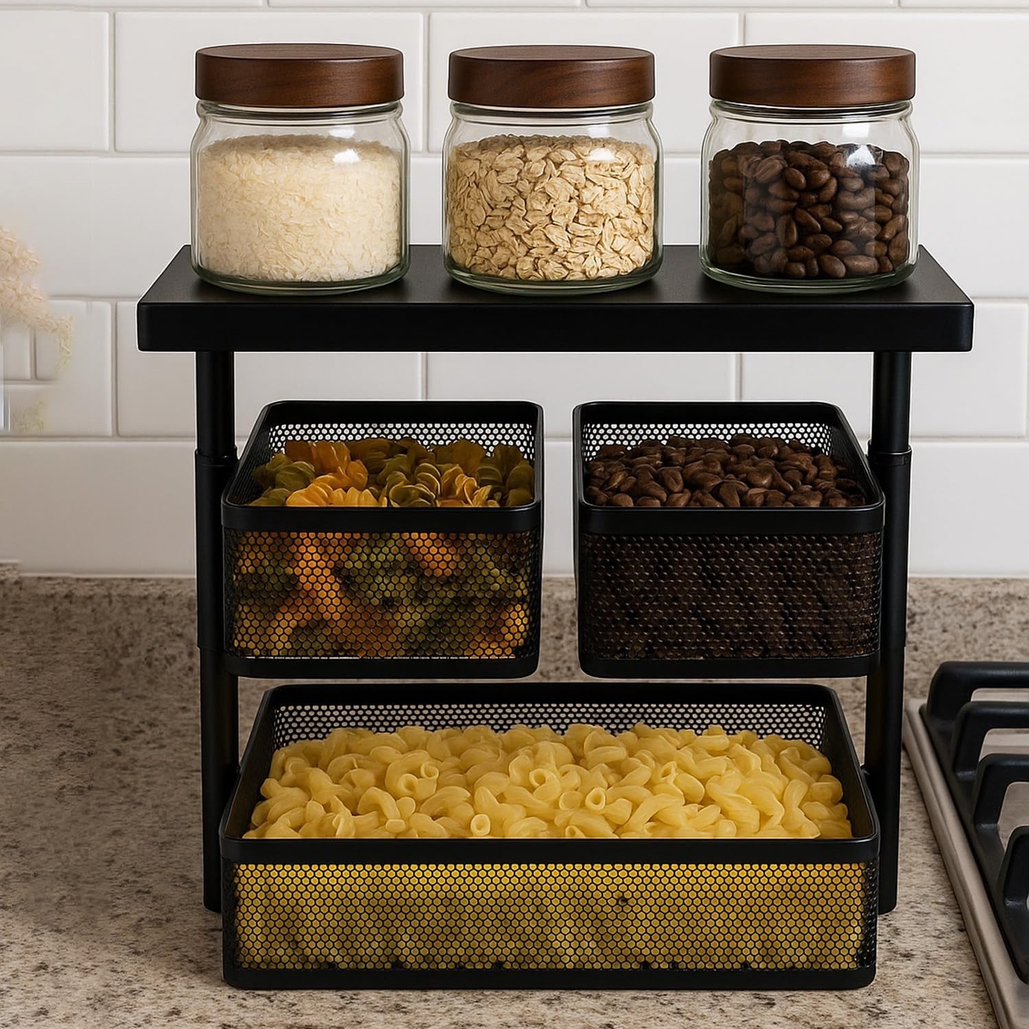 Go Hooked black metal 3-tier rotating storage rack with mesh baskets holding pasta, coffee beans, and rice. Also features glass jars with wooden lids.
