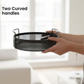 GoHooked black round metal storage tray with perforated design and curved handles, perfect for home decor, vanity, or kitchen organization.