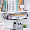 GoHooked black metal undershelf storage basket with books and a pink mouse. Ideal for cabinets and pantries.