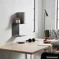 GoHooked black heavy duty iron wall mounted shelves displaying a book and plant. Ideal for study or living rooms.