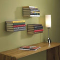 GoHooked black heavy duty iron wall mounted book shelves holding stacks of books in a study or living room.