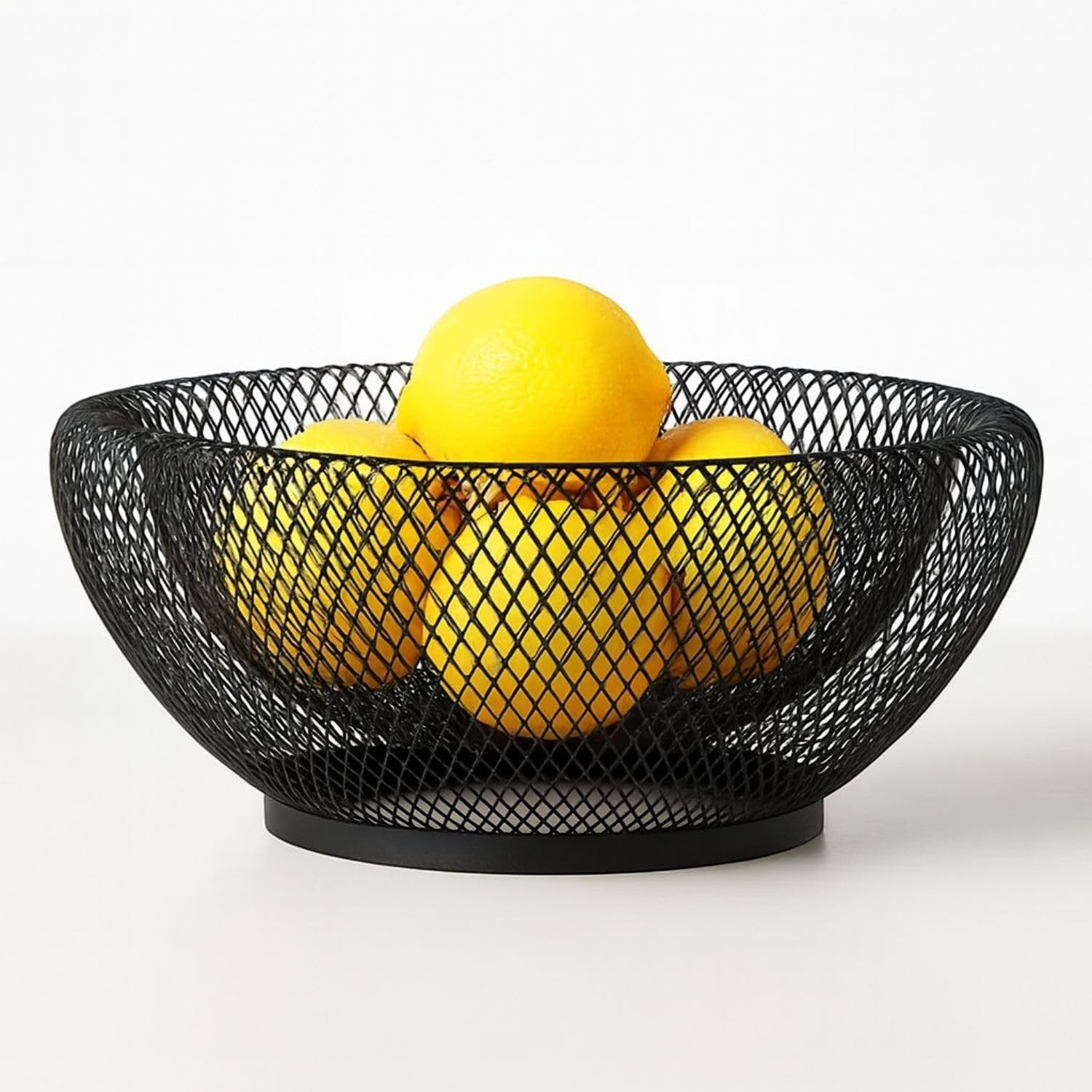 Go Hooked black metal wire fruit basket with a wooden base, featuring an open mesh design for airflow. Holds lemons.