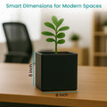 GoHooked black polymer 8-inch modern cube planter pot with a small green plant on a wooden desk.