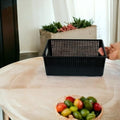 GoHooked black plastic storage basket with handles, perforated design, ideal for cosmetics, office, or fruit.