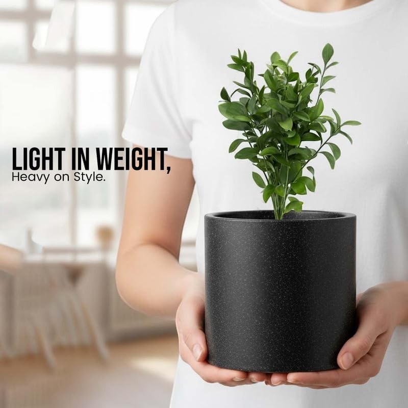 GoHooked 10-inch black polymer round planter with a small green plant. Lightweight and durable for indoor/outdoor use.