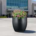 Go Hooked 17-inch black polymer planter with a modern, round design, perfect for indoor or outdoor use.
