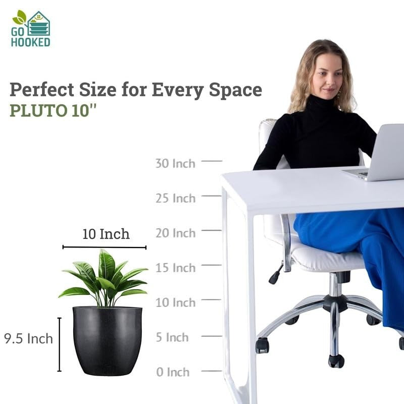 GoHooked Pluto 10-inch black polymer planter pot with drainage, shown next to a woman at a desk.