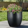 GoHooked 22-inch black polymer planter pot with pink flowers, modern round design, lightweight and durable.