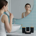 GoHooked black ribbed bathroom accessories set with soap dispenser, toothbrush holder, tumbler, and soap dish.