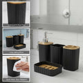 Go Hooked black ribbed bathroom accessory set with soap dispenser, toothbrush holder, tumbler, and soap dish.