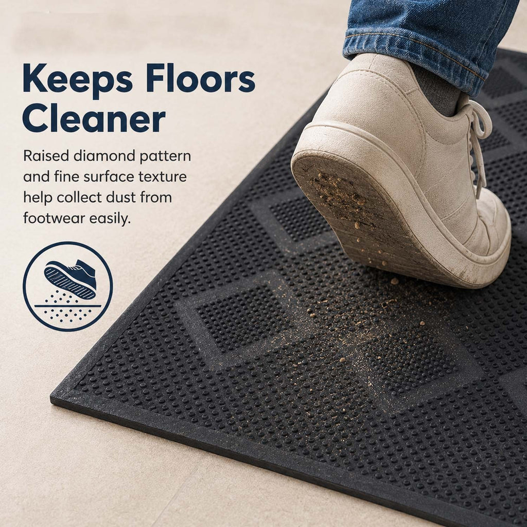 GoHooked black rubber door mat with a textured diamond pattern, shown in use on a floor to trap dirt from a shoe.