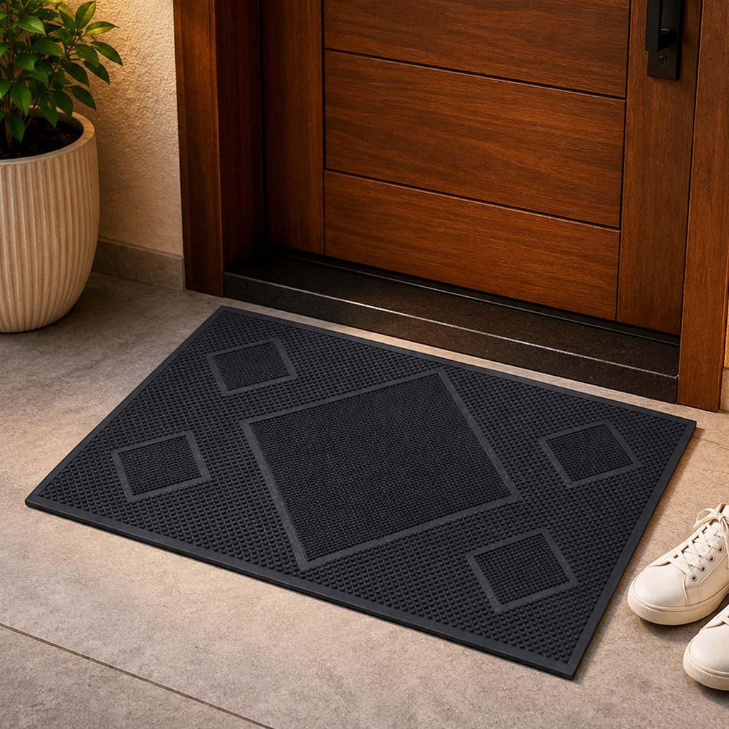 GoHooked black rectangular rubber door mat with a textured diamond pattern placed at a home entrance.