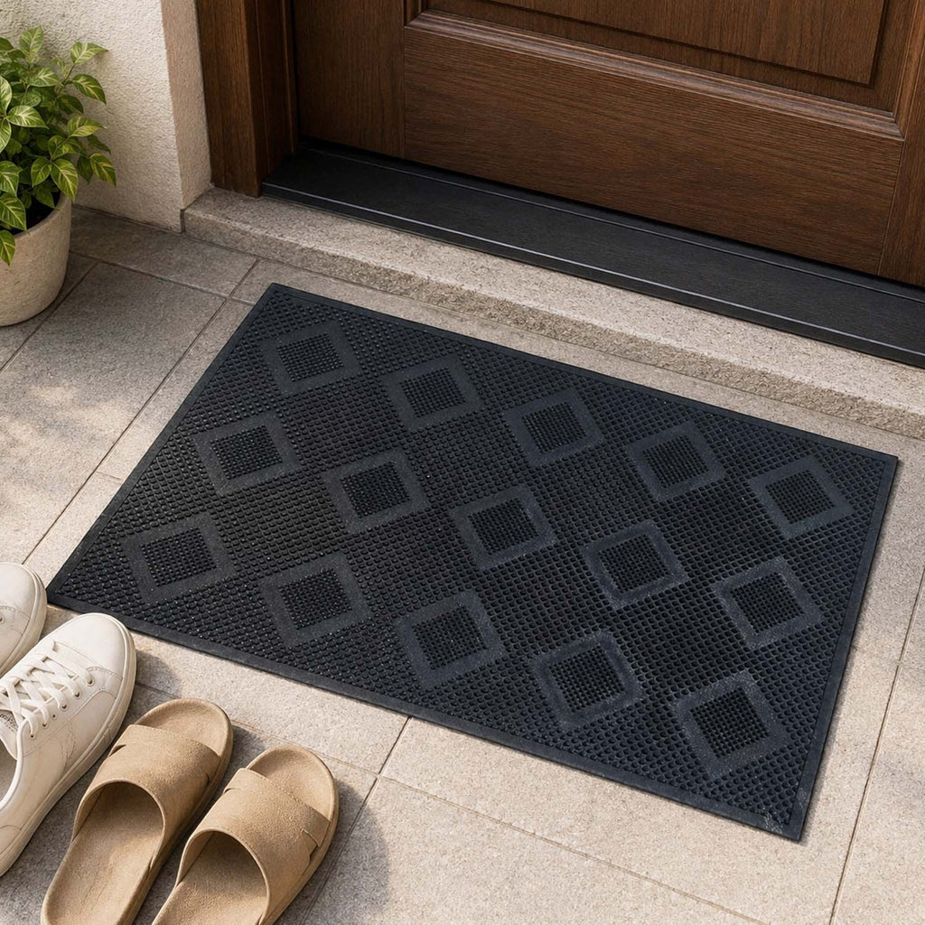 GoHooked black rubber door mat with a textured diamond pattern, placed at a home entrance for indoor or outdoor use.