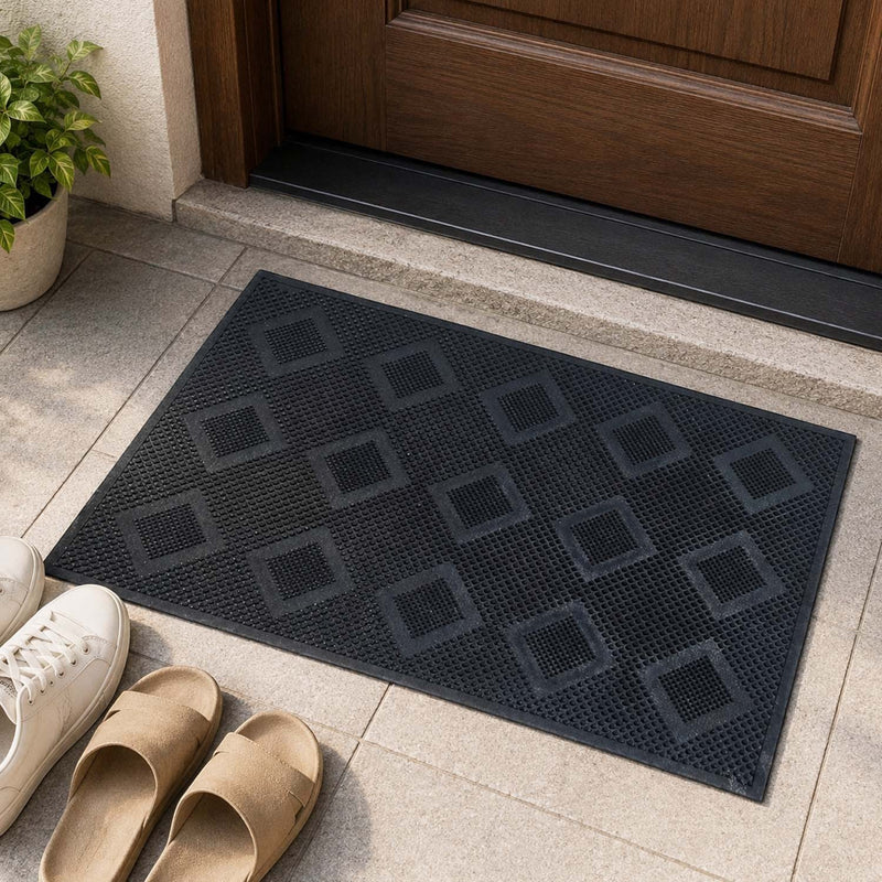 GoHooked black rubber door mat with a textured diamond pattern, placed at a home entrance for indoor or outdoor use.