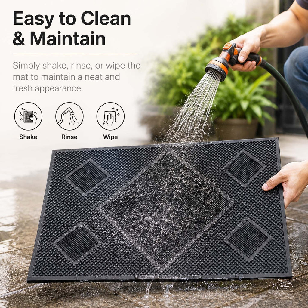 GoHooked black rubber door mat with textured diamond pattern being rinsed with a garden hose for easy cleaning