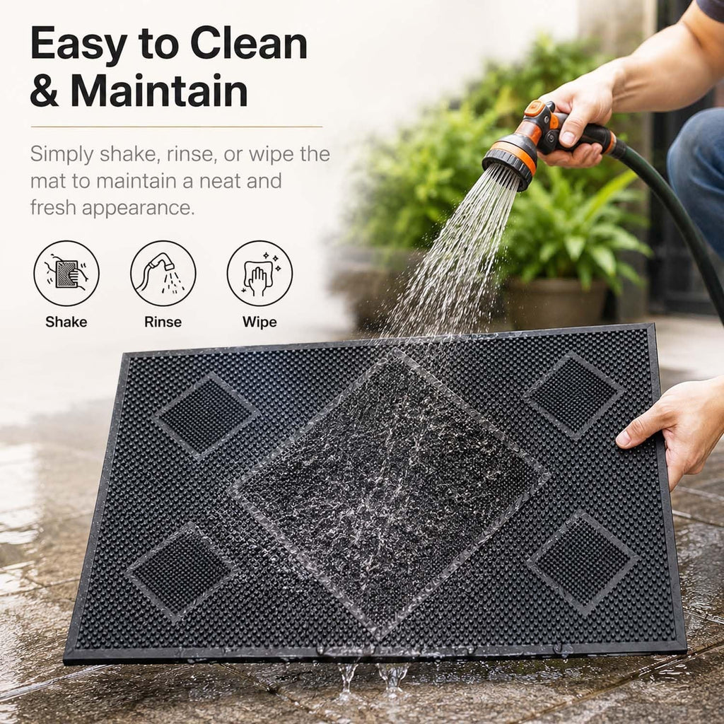 GoHooked black rubber door mat with diamond pattern being rinsed with a garden hose for easy cleaning
