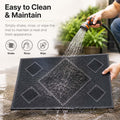 GoHooked black rubber door mat with diamond pattern being rinsed with a garden hose for easy cleaning