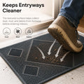 GoHooked black rubber door mat with a textured diamond pattern collecting dirt from a shoe at an entryway