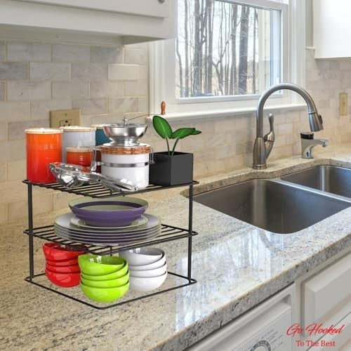Go Hooked black steel corner shelf rack holding plates, bowls, and kitchen canisters. Ideal for kitchen organization.