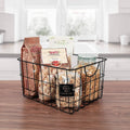 GoHooked black steel wire utility basket with curved handles, holding pasta and pantry items.