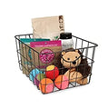 GoHooked black steel wire storage basket with curved handles, holding pet toys and supplies.