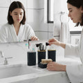 GoHooked black textured square bathroom accessory set with soap dispenser, toothbrush holder, tumbler, and soap dish.