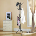 Go Hooked black wrought iron 3-tier coat rack with 12 hooks, holding a hat, shirt, and scarf.