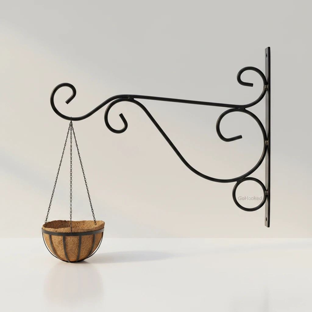 GoHooked black wrought iron hanging planter bracket with decorative scrollwork and a coconut coir basket.
