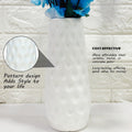 Go Hooked blue artificial blossoms in a white textured ceramic vase. Realistic faux flowers for home and office decor.