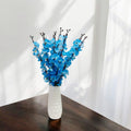 Go Hooked artificial blue blossoms in a white textured ceramic vase, perfect for home and office decor.