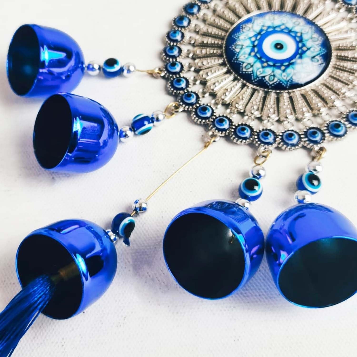 GoHooked blue glass evil eye wind chime with 5 bells and tassel, believed to ward off negative energy.