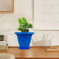 GoHooked blue plastic planter pot with saucer, 6 inch twister design for indoor/outdoor plants.