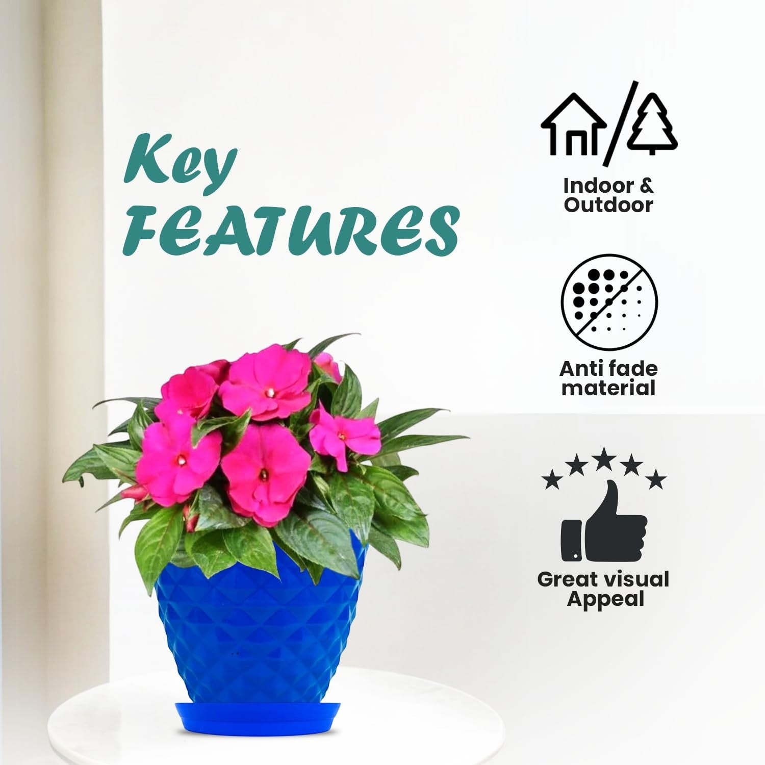 GoHooked blue diamond-patterned plastic planter pot with saucer, holding pink impatiens flowers. Suitable for indoor/outdoor use.