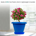 GoHooked blue 6-inch plastic planter pot with saucer, featuring a modern ribbed design and a vibrant pink flowering plant.
