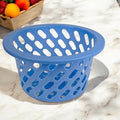 Go Hooked blue plastic storage basket with diamond-shaped cutouts and a wide rim. Ideal for kitchen or pantry organization.
