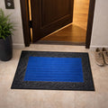 GoHooked blue rubber door mat with a decorative black border and ribbed surface placed at a home entrance.