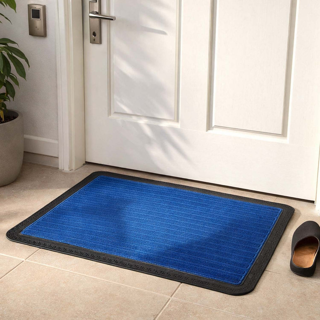 GoHooked blue rubber door mat with ribbed texture and black border placed at a home entrance for dirt trapping