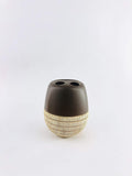 GoHooked brown and beige ceramic toothbrush holder with two openings and textured base.