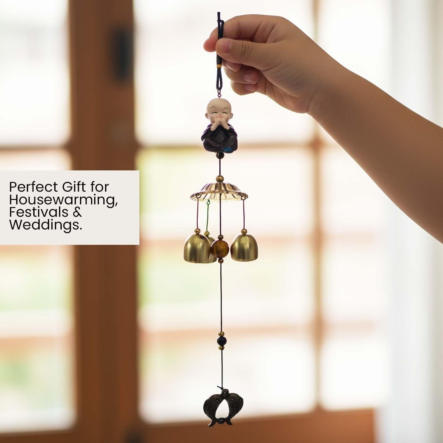 GoHooked brown metal Feng Shui monk figurine wind chime with 3 brass bells and decorative charm.